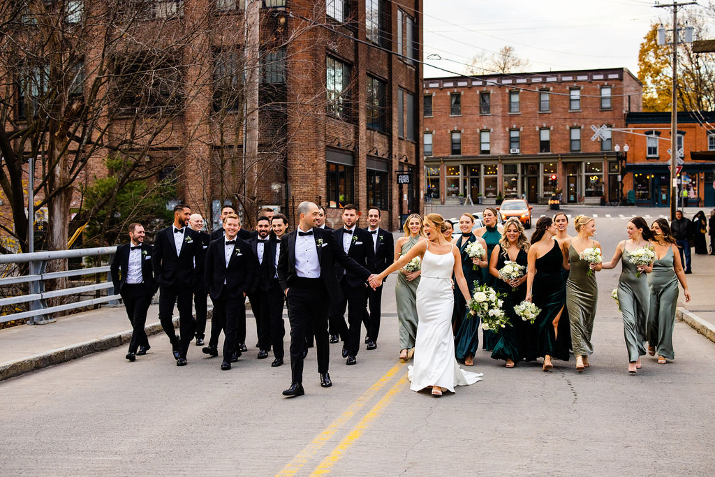 Wedding Party walking down the street next to their wedding venue, the Roundhouse, in Beacon NY