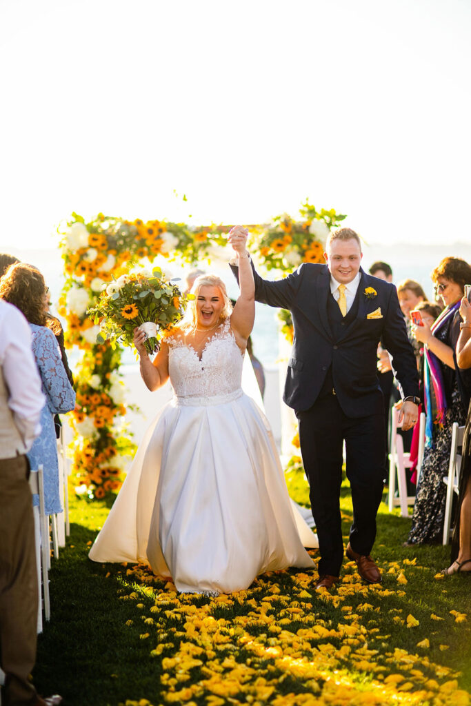 Ceremony site with sunflowers at Belle Mer wedding in Newport, RI 