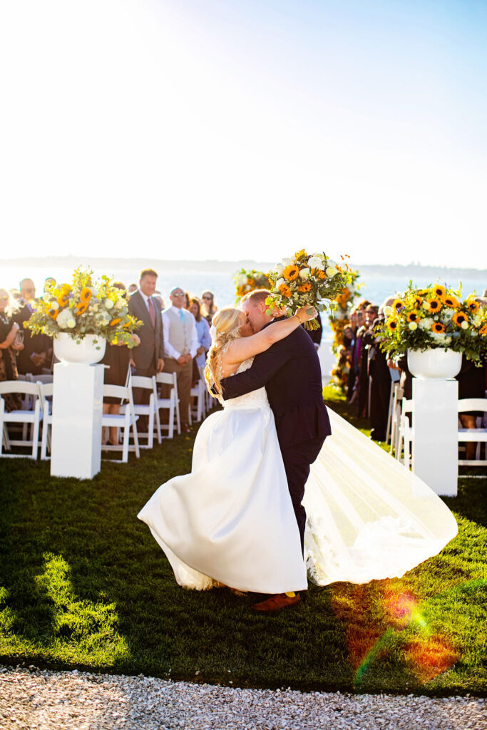 Ceremony site with sunflowers at Belle Mer wedding in Newport, RI 