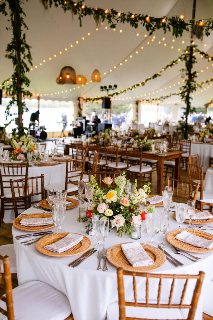 Reception tent with ratan lanterns and greenery at Mount Hope Farm wedding