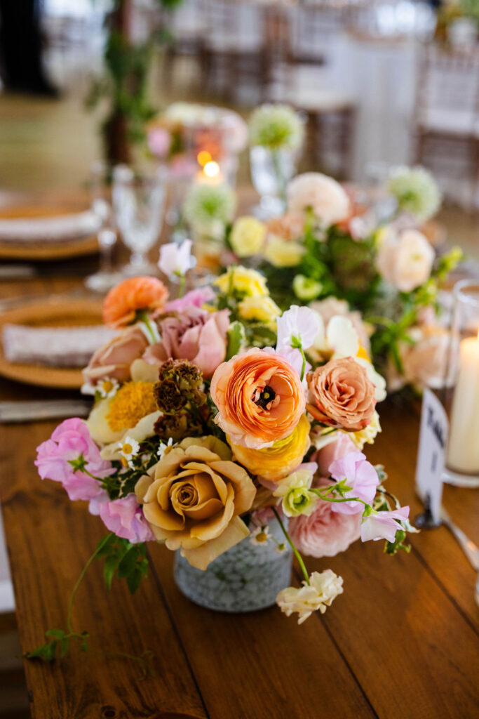 Reception tent with ratan lanterns and greenery at Mount Hope Farm wedding