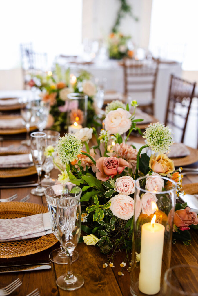 Reception tent with ratan lanterns and greenery at Mount Hope Farm wedding