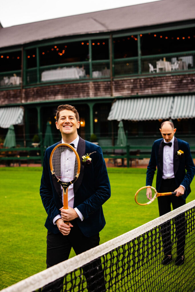 Grooms posing on the green at their Tennis Hall of Fame Wedding in Newport, Rhode Island