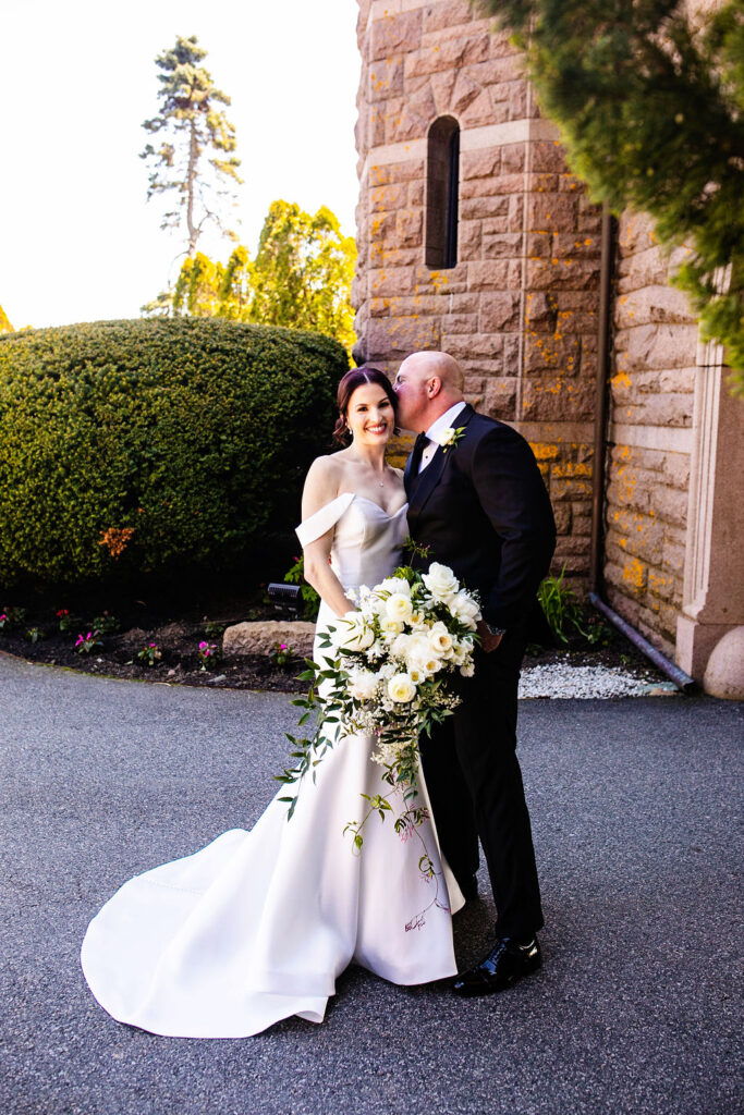 Bride and groom under arch at Oceancliff wedding in Newport Rhode Island Wedding Photographer