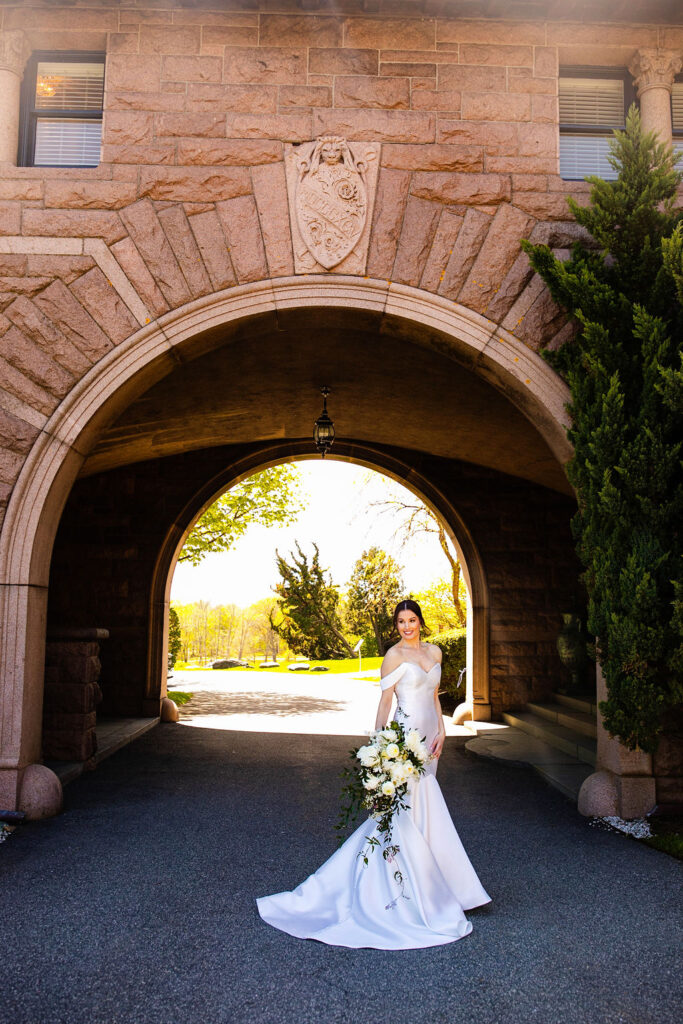 Bride outside of Oceancliff wedding in Newport Rhode Island Wedding Photographer