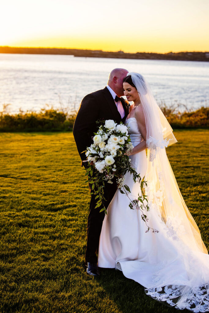 Bride and groom at sunset at Oceancliff wedding in Newport Rhode Island Wedding Photographer