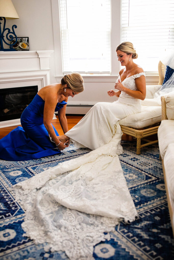 Bride with her bridesmaids getting ready for the wedding at the Belle Mer Island House in Newport, RI.