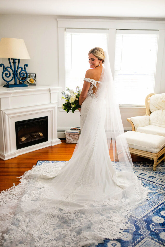 Bride with her bridesmaids getting ready for the wedding at the Belle Mer Island House in Newport, RI.