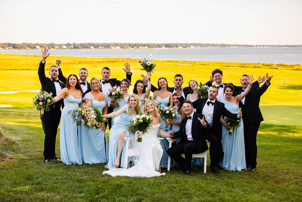 Wedding party posing by the water Rhode Island Country Club
