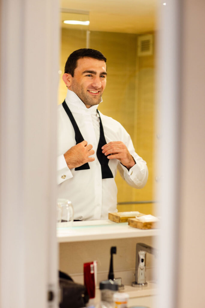 Groom getting ready for wedding at  in Newport, RI