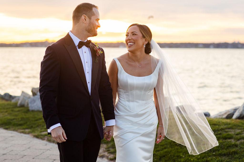 bride and groom post for photos at sunset at Newport Harbor Island Resort wedding